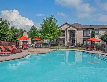 Sparkling pool with outdoor fireplace